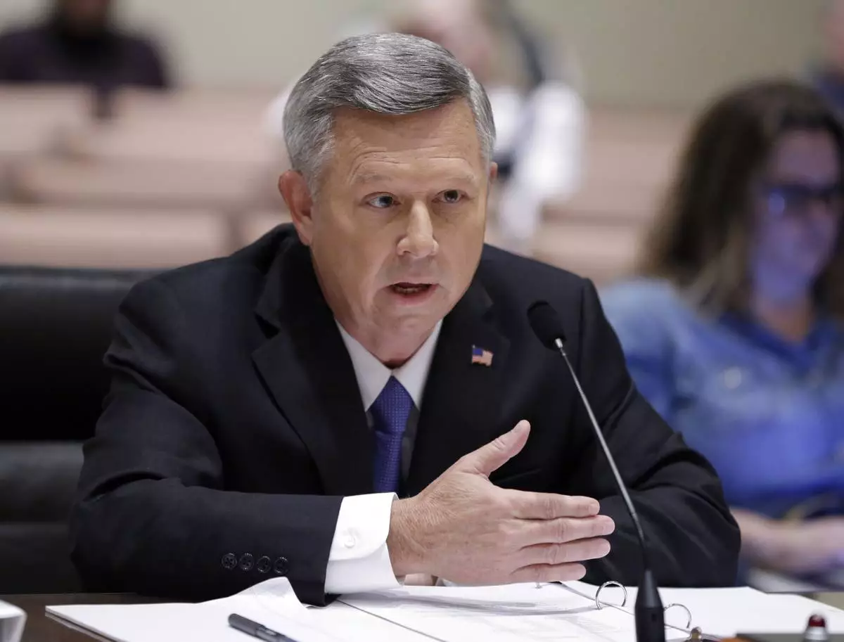 FILE - Nebraska Gov. Dave Heineman testifies before a legislative committee in Lincoln, Neb., Oct. 29, 2014. (AP Photo/Nati Harnik, File)
