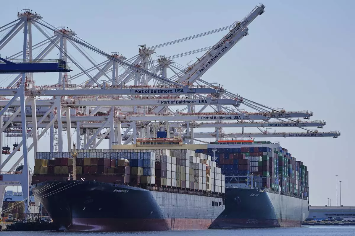 Container ships Epaminondas and Talos are docked at the Port of Baltimore, Wednesday, April 9, 2025, in Baltimore. (AP Photo/Stephanie Scarbrough)
