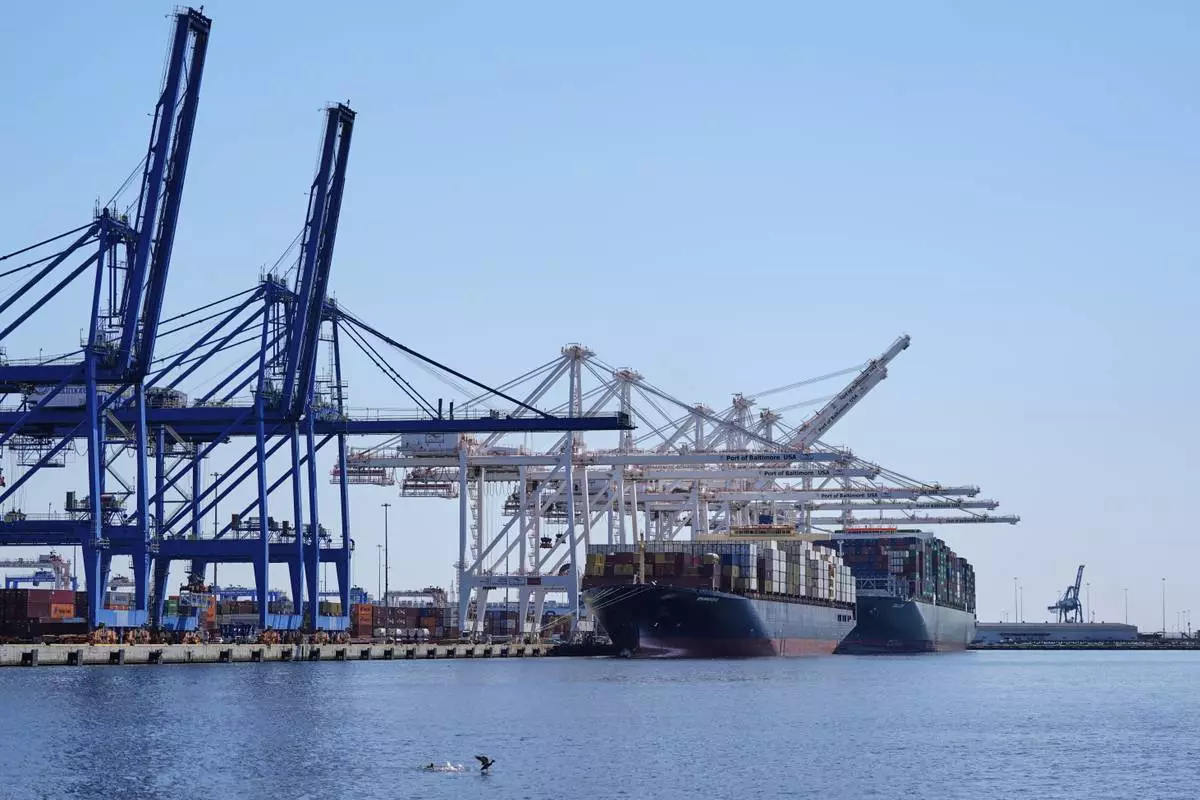 Container ships Epaminondas and Talos are docked at the Port of Baltimore, Wednesday, April 9, 2025, in Baltimore. (AP Photo/Stephanie Scarbrough)