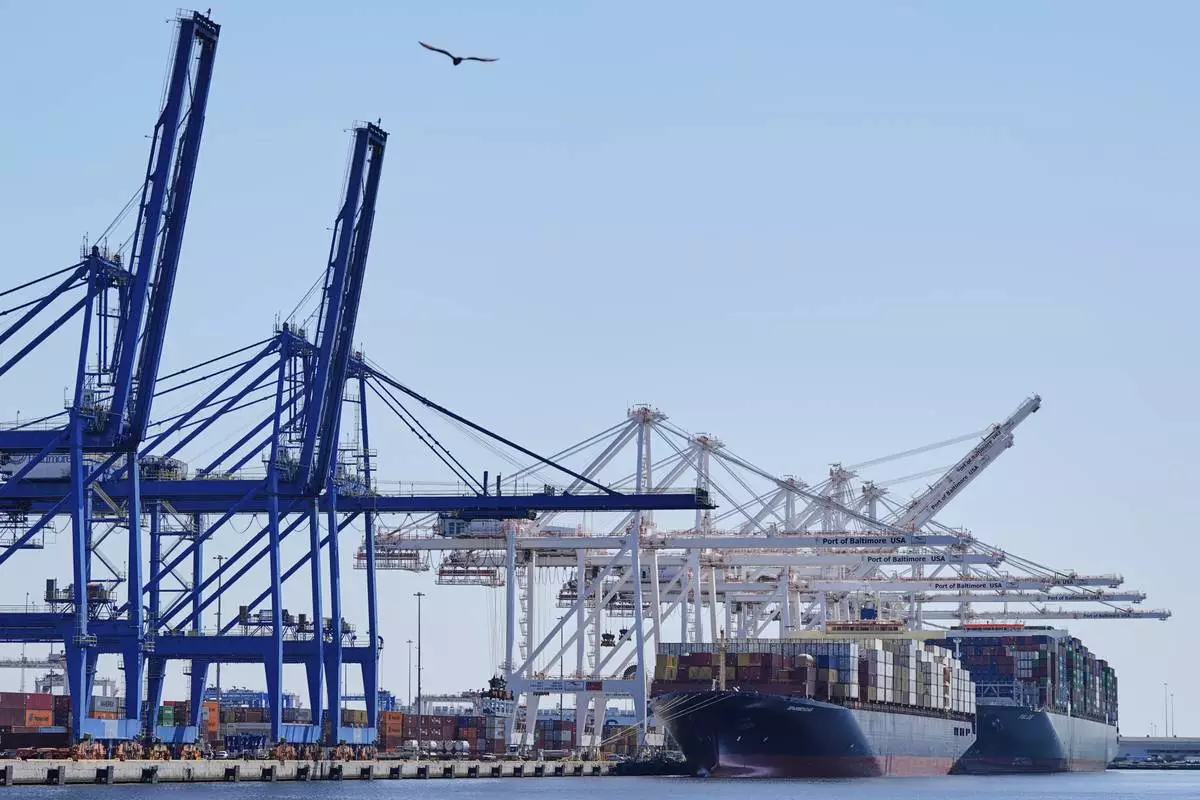 Container ships Epaminondas and Talos are docked at the Port of Baltimore, Wednesday, April 9, 2025, in Baltimore. (AP Photo/Stephanie Scarbrough)