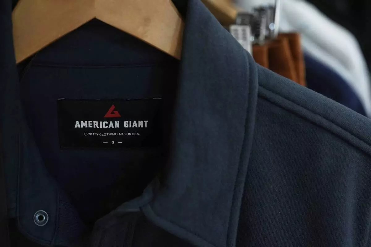 An American Giant logo is shown on clothing at the company's showroom in San Francisco, Thursday, April 17, 2025. (AP Photo/Jeff Chiu)