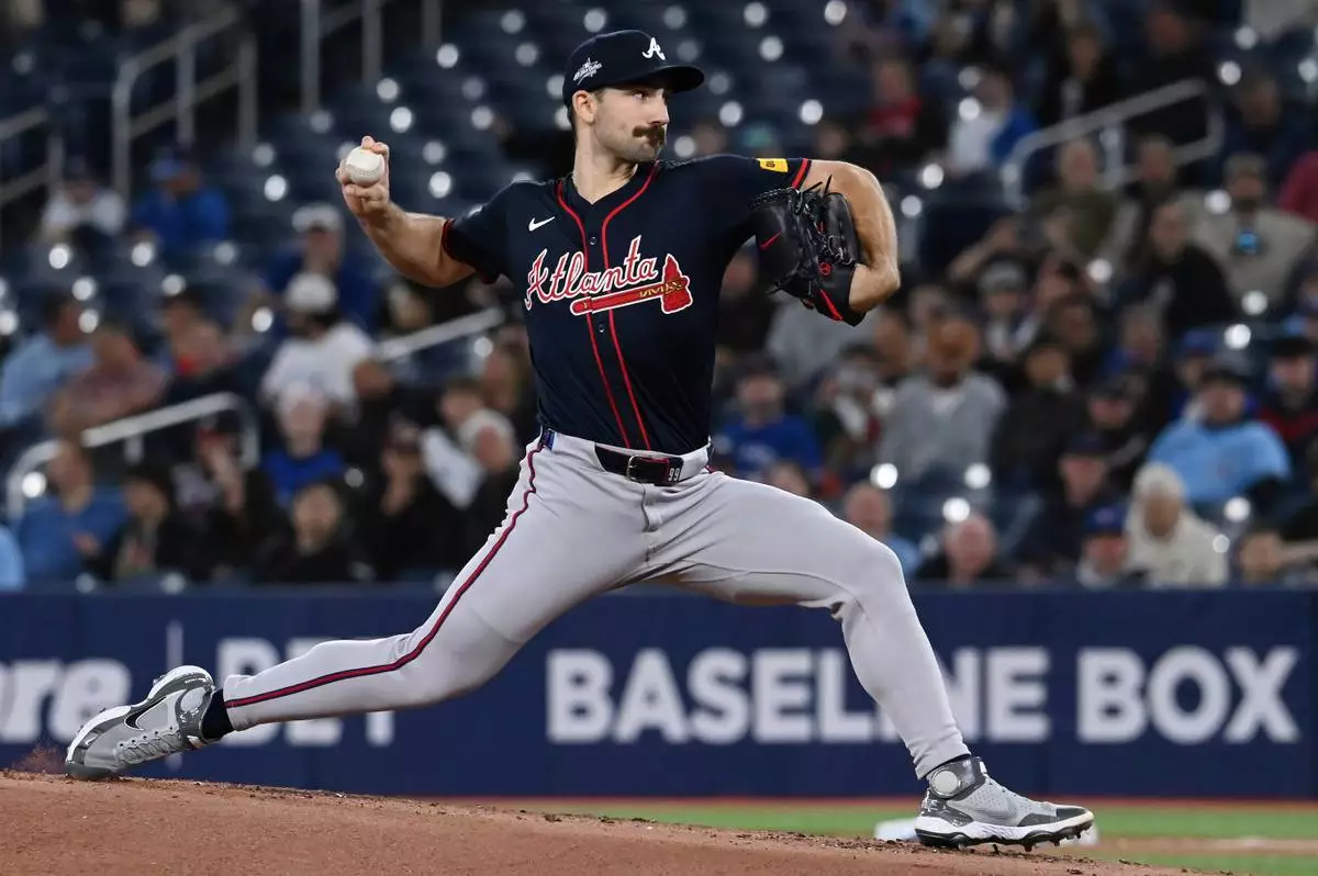 Atlanta Braves starting pitcher Spencer Strider (99) throws to a Toronto Blue Jays batter in the first inning of an interleague baseball game in Toronto, Wednesday, April 16, 2025. (Jon Blacker/The Canadian Press via AP)