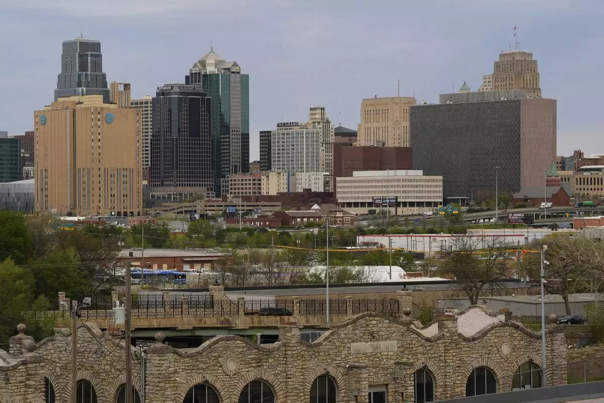 The Richard Bolling federal building is seen at right among other downtown landmarks, Monday, April 14, 2025, in Kansas City, Mo. (AP Photo/Charlie Riedel)