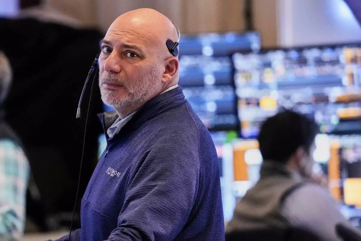 Trader Vincent Napolitano works on the floor of the New York Stock Exchange, Wednesday, April 16, 2025. (AP Photo/Richard Drew)