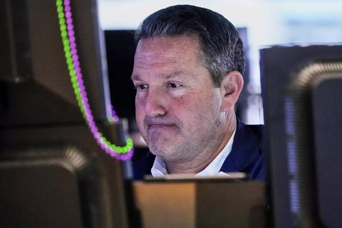 Trader Leon Montana works on the floor of the New York Stock Exchange, Wednesday, April 16, 2025. (AP Photo/Richard Drew)