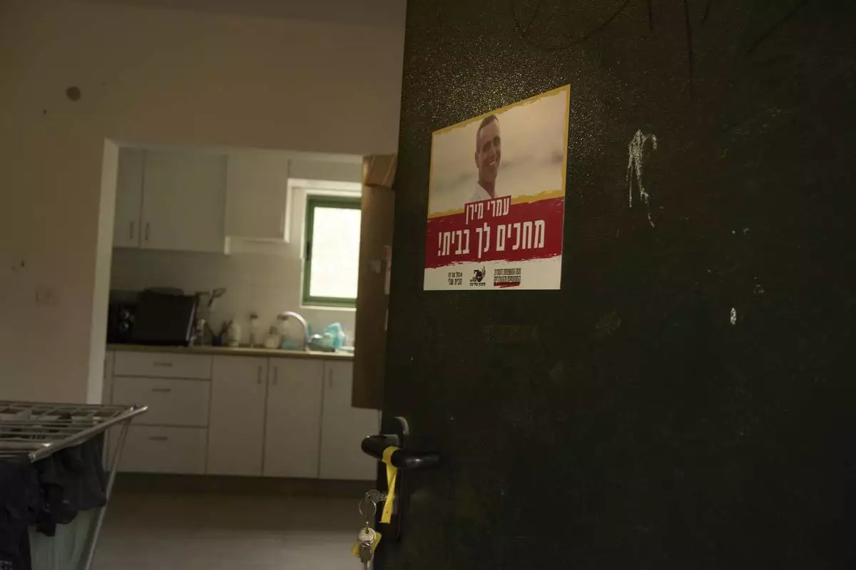 A poster depicting Omri Miran, who is held captive by Hamas in the Gaza Strip, at the family's home in Kibbutz Nahal Oz, southern Israel, Wednesday, April 9, 2025. (AP Photo/Maya Alleruzzo)