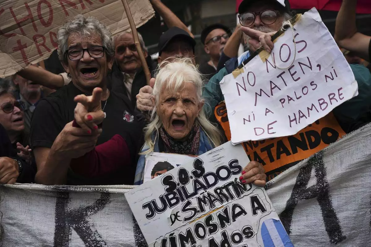 Retirees and their supporters participate in a weekly demonstration against President Javier Milei's austerity measures, in Buenos Aires, Argentina, April 9, 2025. (AP Photo/Rodrigo Abd)