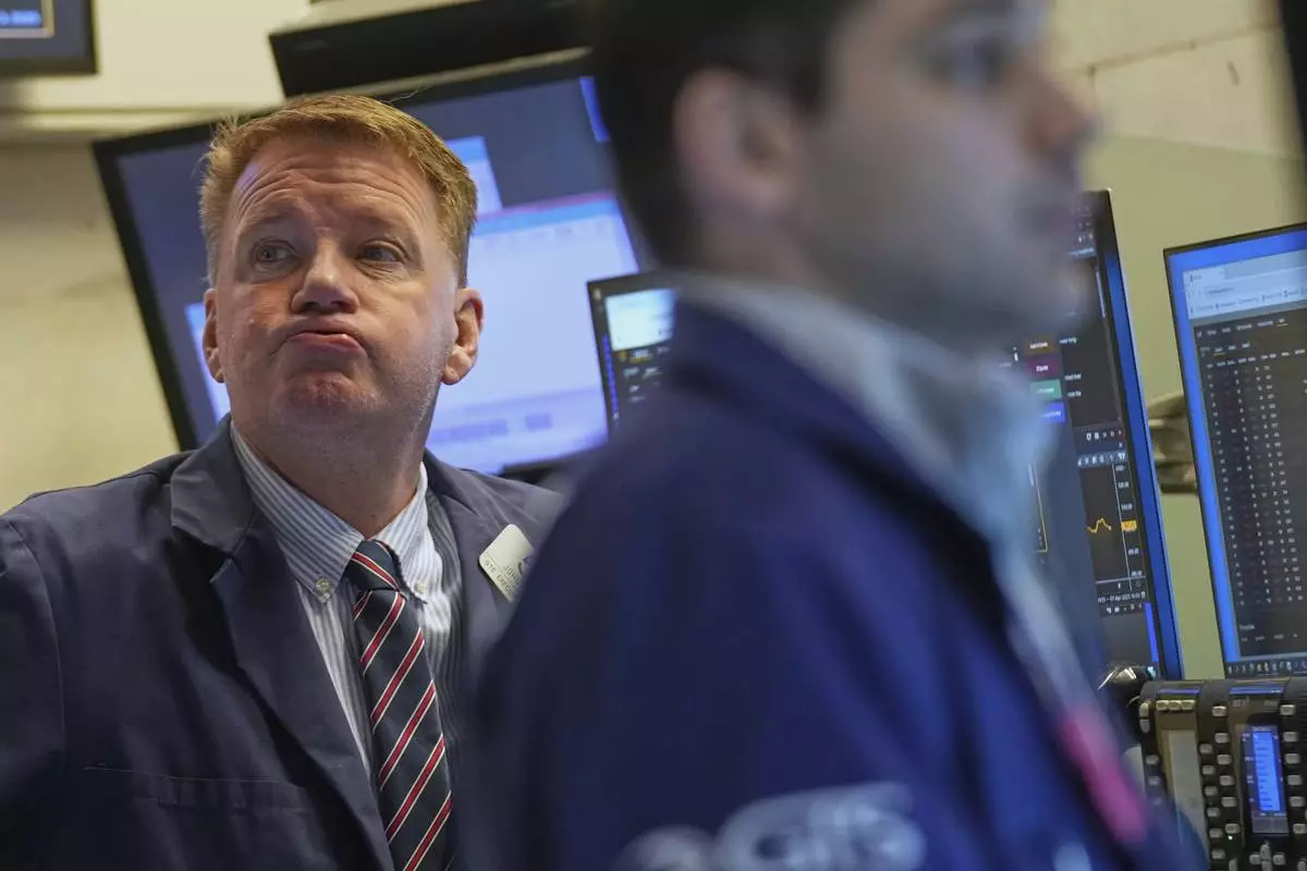 John Bowers works on the floor at the New York Stock Exchange in New York, April 9, 2025. (AP Photo/Seth Wenig)