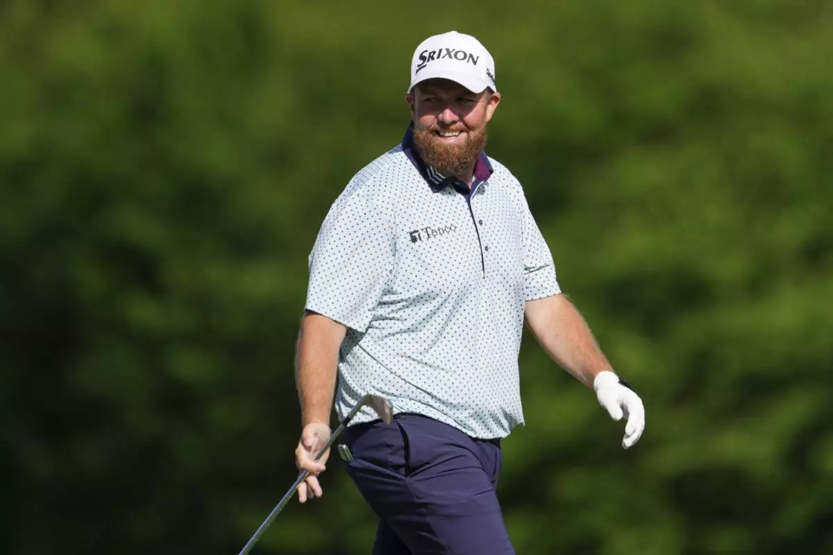 Shane Lowry, of Ireland, smiles on the 12th hole during the third round at the Masters golf tournament, Saturday, April 12, 2025, in Augusta, Ga. (AP Photo/Matt Slocum)