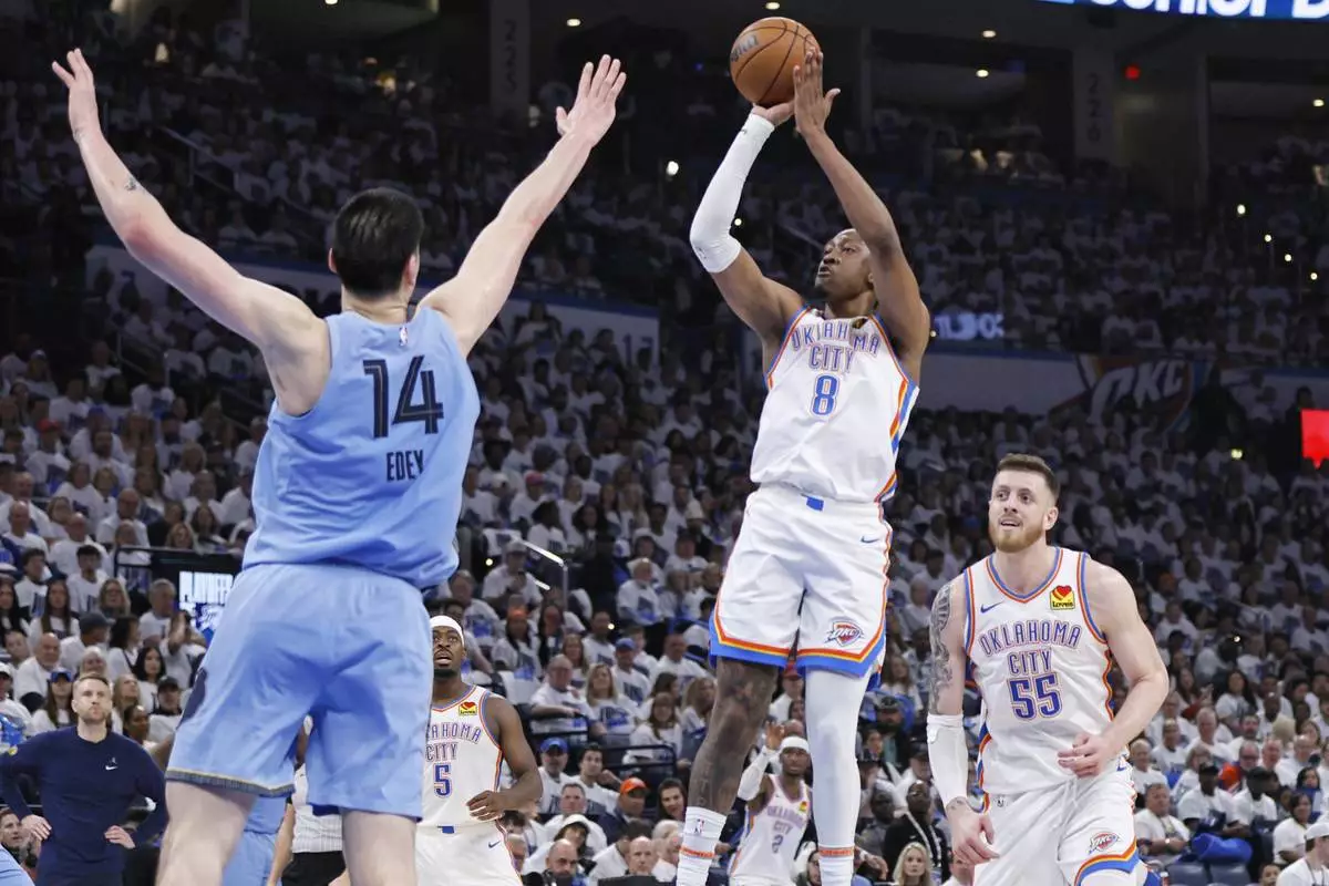 Oklahoma City Thunder forward Jalen Williams (8) looks to shoot over Memphis Grizzlies center Zach Edey (14) as Thunder center Isaiah Hartenstein (55) looks on during the first half in Game 1 of an NBA first-round playoff series, Sunday, April 20, 2025, in Oklahoma City. (AP Photo/Nate Billings)