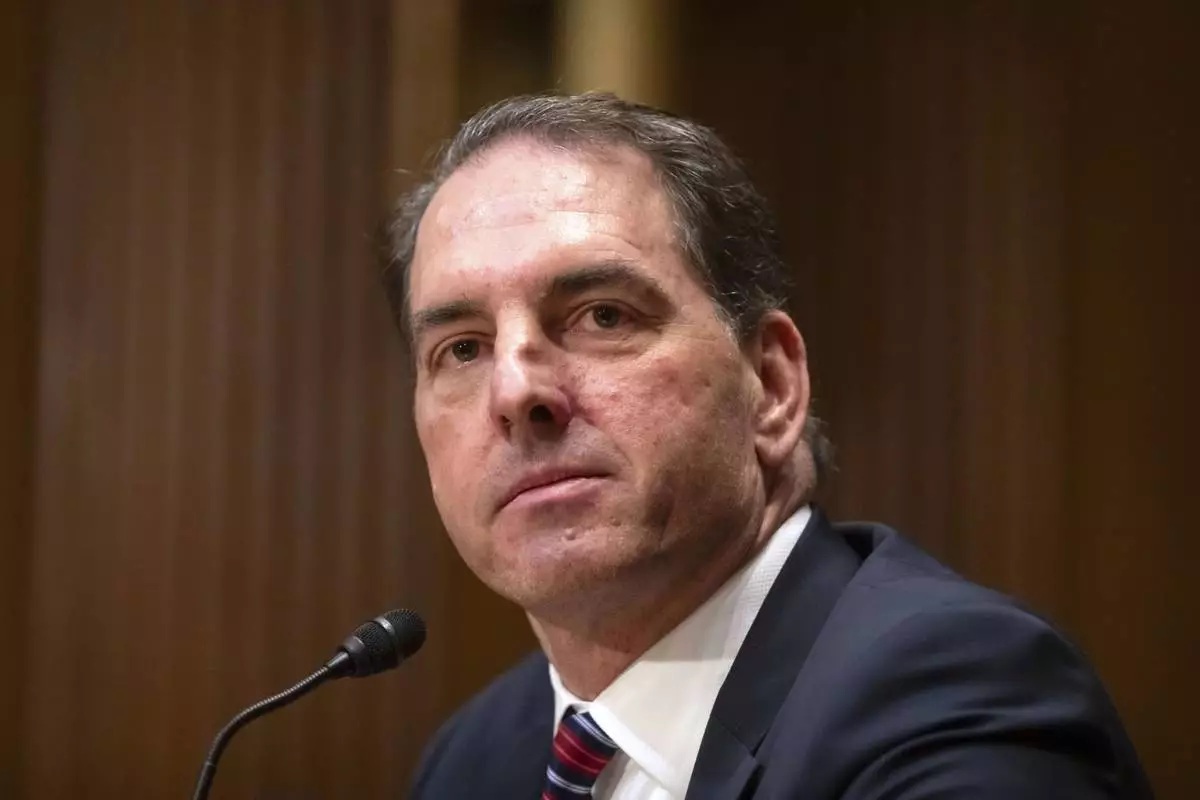 FILE - Michael Faulkender, President Donald Trump's pick to be Deputy Secretary of the Treasury, listens during a hearing of the Senate Committee on Finance on Capitol Hill, March 6, 2025, in Washington. (AP Photo/Mark Schiefelbein, File)