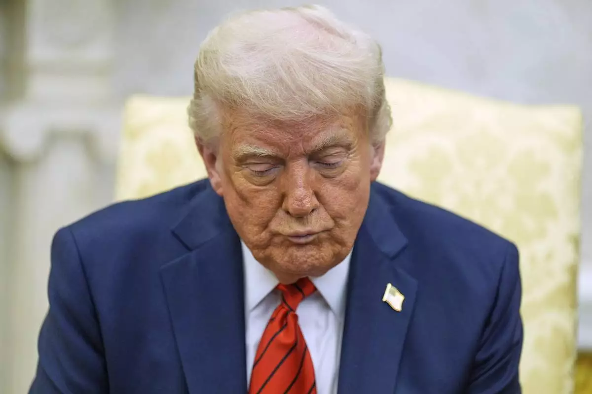 President Donald Trump listens as he meets with Italy's Prime Minister Giorgia Meloni in the Oval Office of the White House, Thursday, April 17, 2025, in Washington. (AP Photo/Alex Brandon)