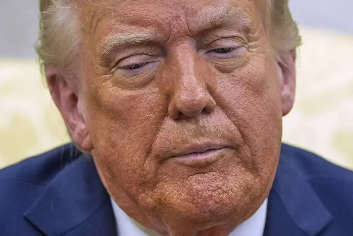 President Donald Trump listens as he meets with Italy's Prime Minister Giorgia Meloni in the Oval Office of the White House, Thursday, April 17, 2025, in Washington. (AP Photo/Alex Brandon)