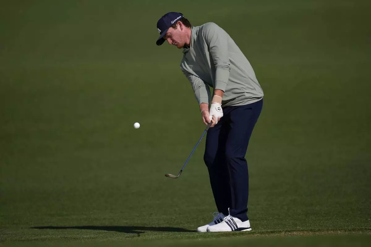 Nick Dunlap chips to the green on the second hole during the first round at the Masters golf tournament, Thursday, April 10, 2025, in Augusta, Ga. (AP Photo/George Walker IV)