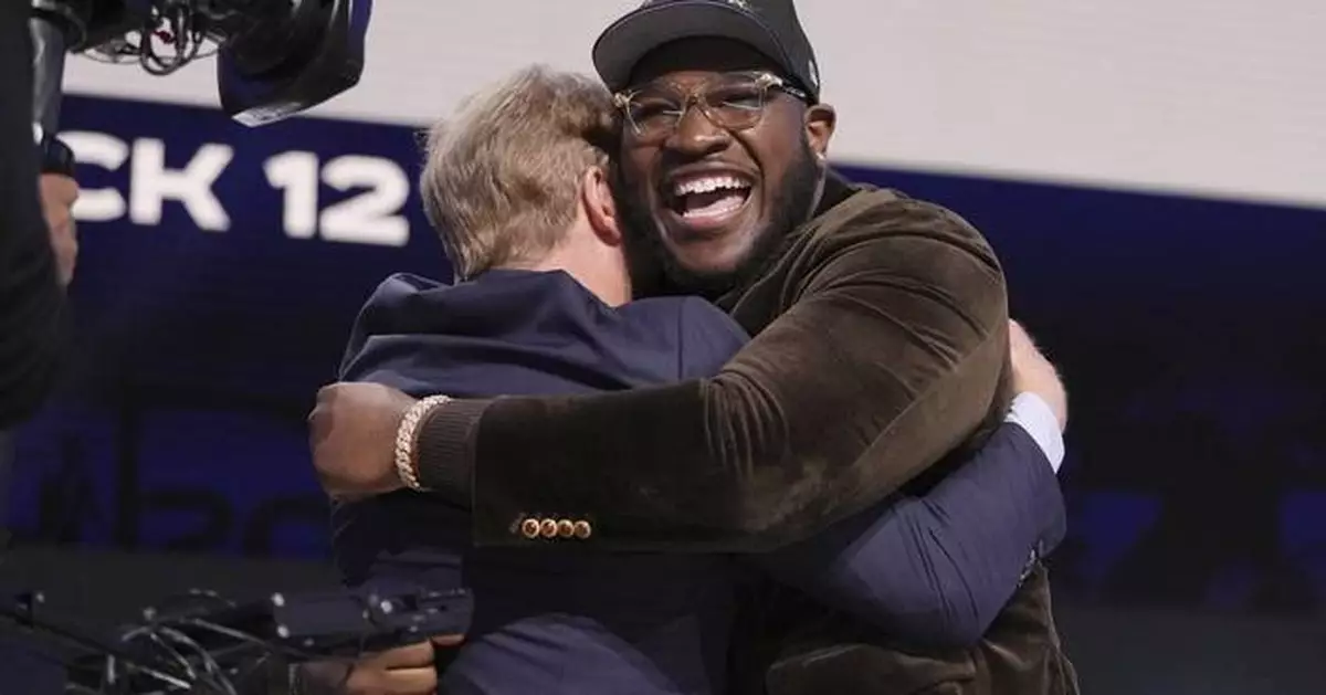 Cowboys take Alabama offensive lineman Tyler Booker with 12th pick in NFL draft