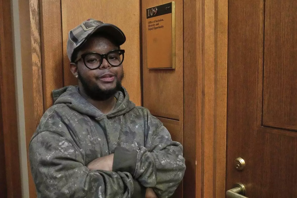 Case Western Reserve University student. Justen Pippens poses for a photo outside the recently closed Office of Inclusion, Diversity and Equal Opportunity at the school In Cleveland Thursday, April 17, 2025. (AP Photo/Sue Ogrocki)