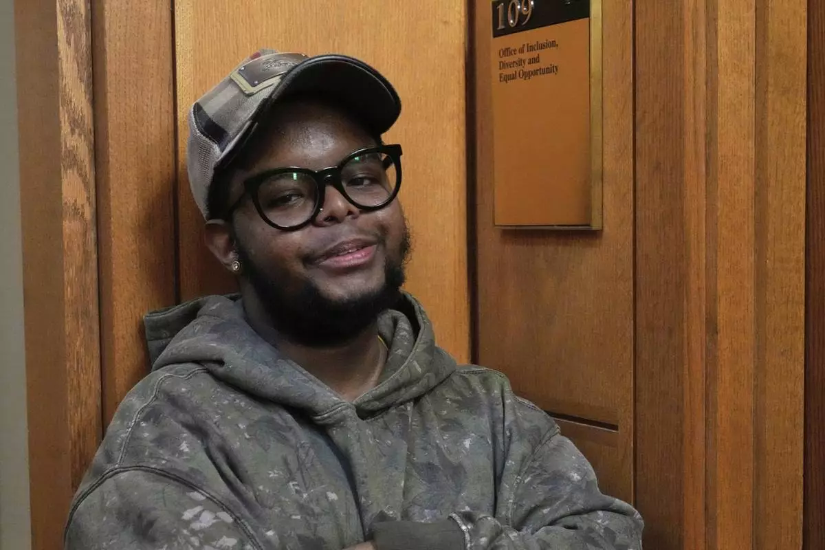 Case Western Reserve University student. Justen Pippens poses for a photo outside the recently closed Office of Inclusion, Diversity and Equal Opportunity at the school In Cleveland Thursday, April 17, 2025. (AP Photo/Sue Ogrocki)