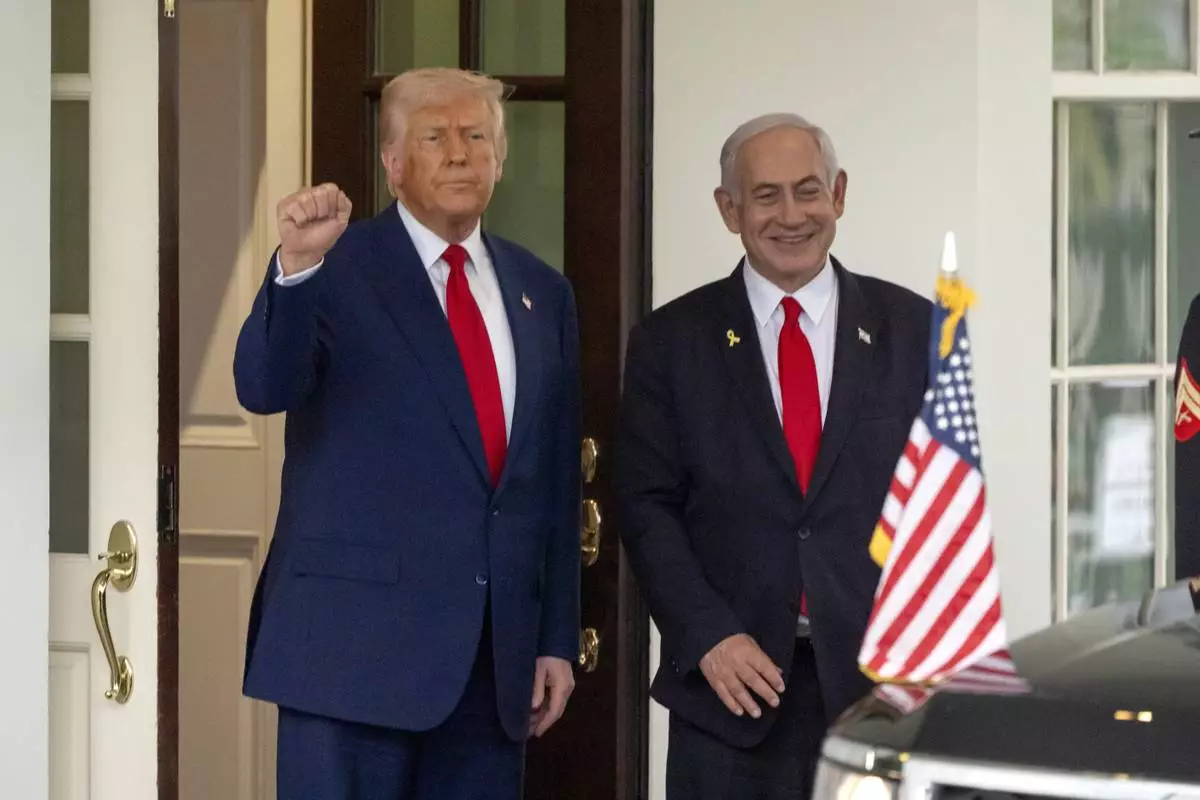 President Donald Trump, left, gestures as Israel's Prime Minister Benjamin Netanyahu leaves the West Wing of the White House, Monday, April 7, 2025, in Washington. (AP Photo/Mark Schiefelbein)