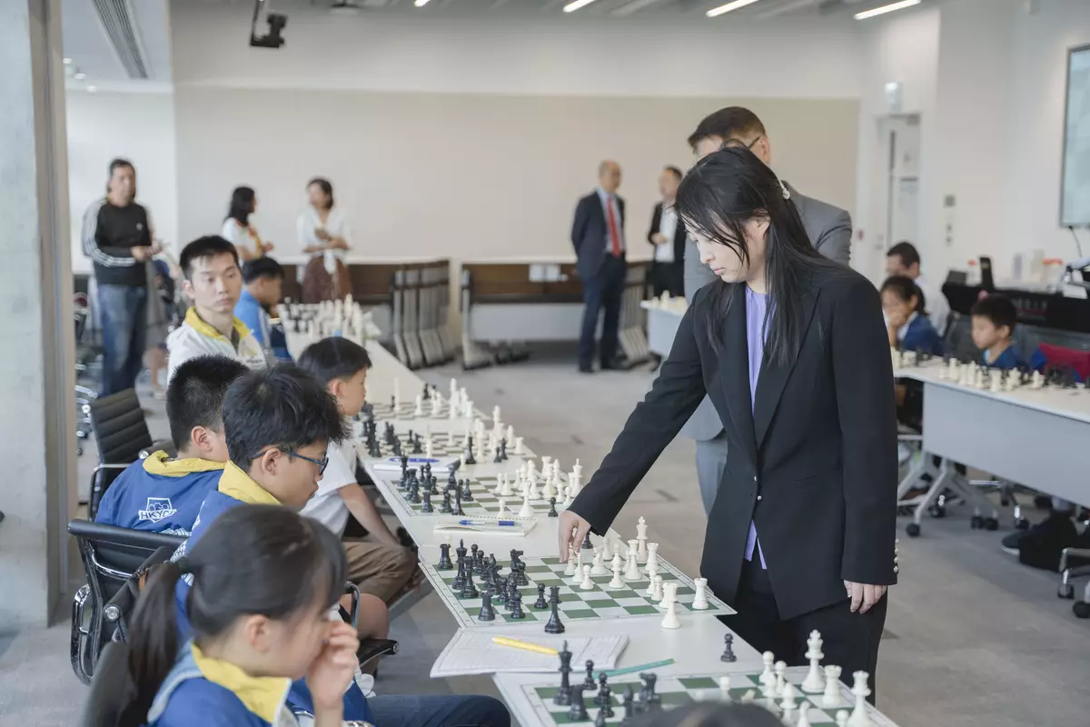 Five-Time World Champion, GM Ju Wenjun and Hong Kong Chess Players in Simultaneous Chess Exhibition .