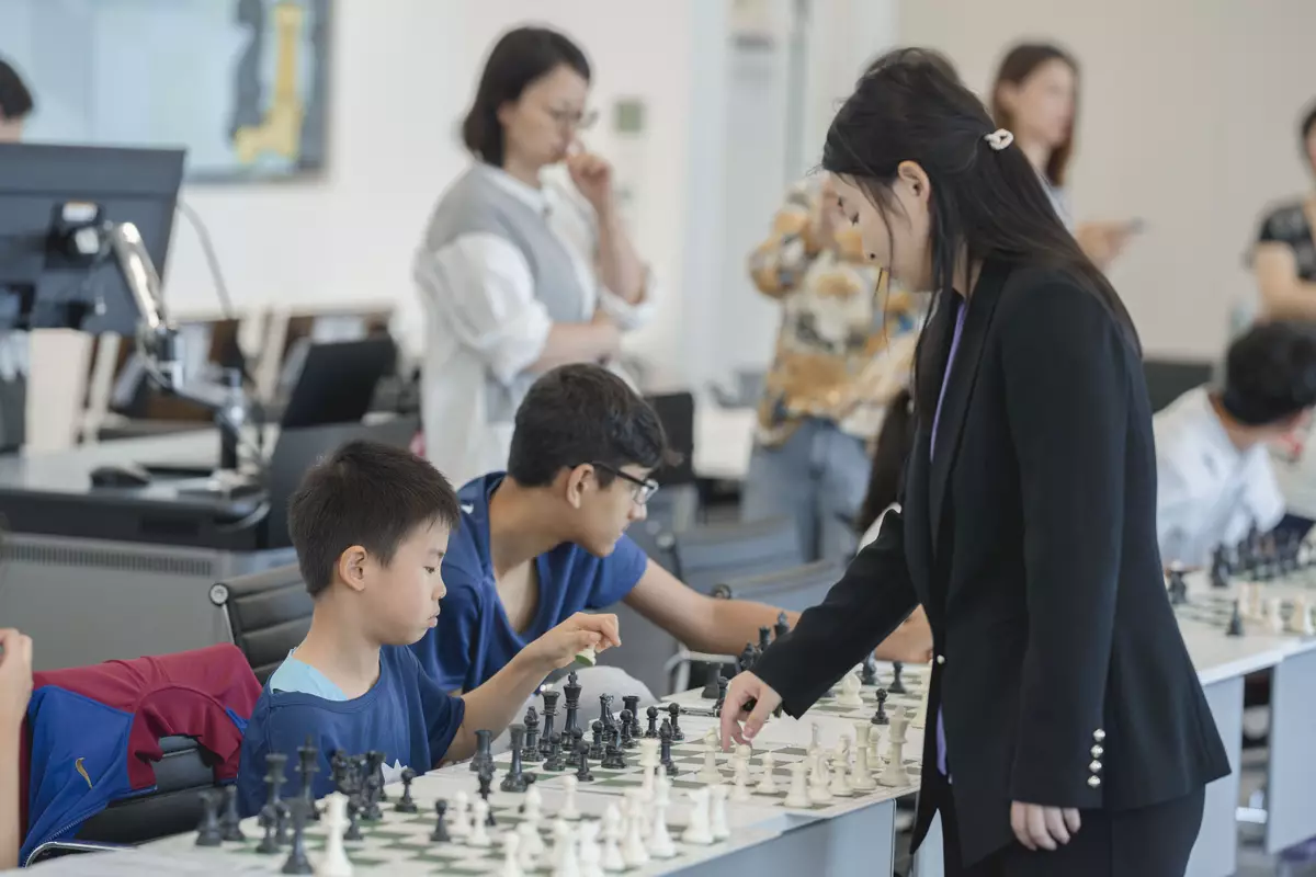 Five-Time World Champion, GM Ju Wenjun and Hong Kong Chess Players in Simultaneous Chess Exhibition .