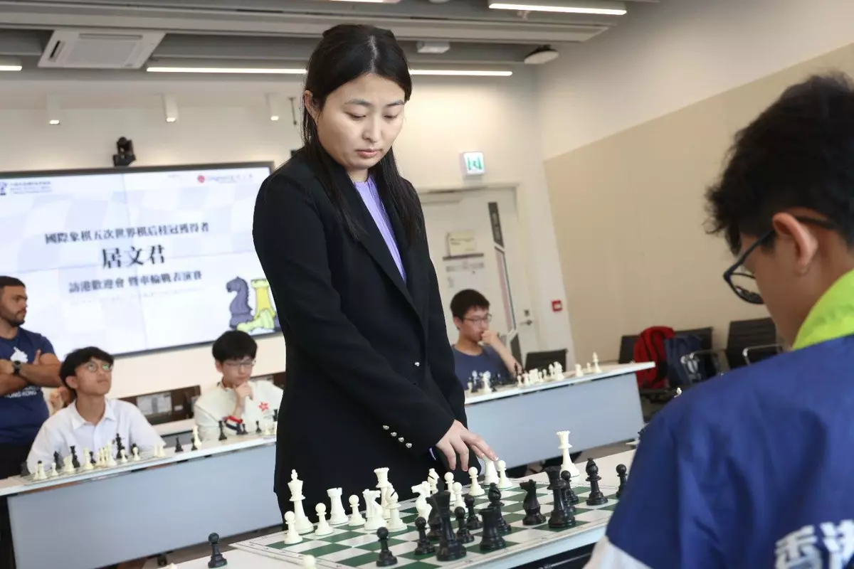 Five-Time World Champion, GM Ju Wenjun and Hong Kong Chess Players in Simultaneous Chess Exhibition .
