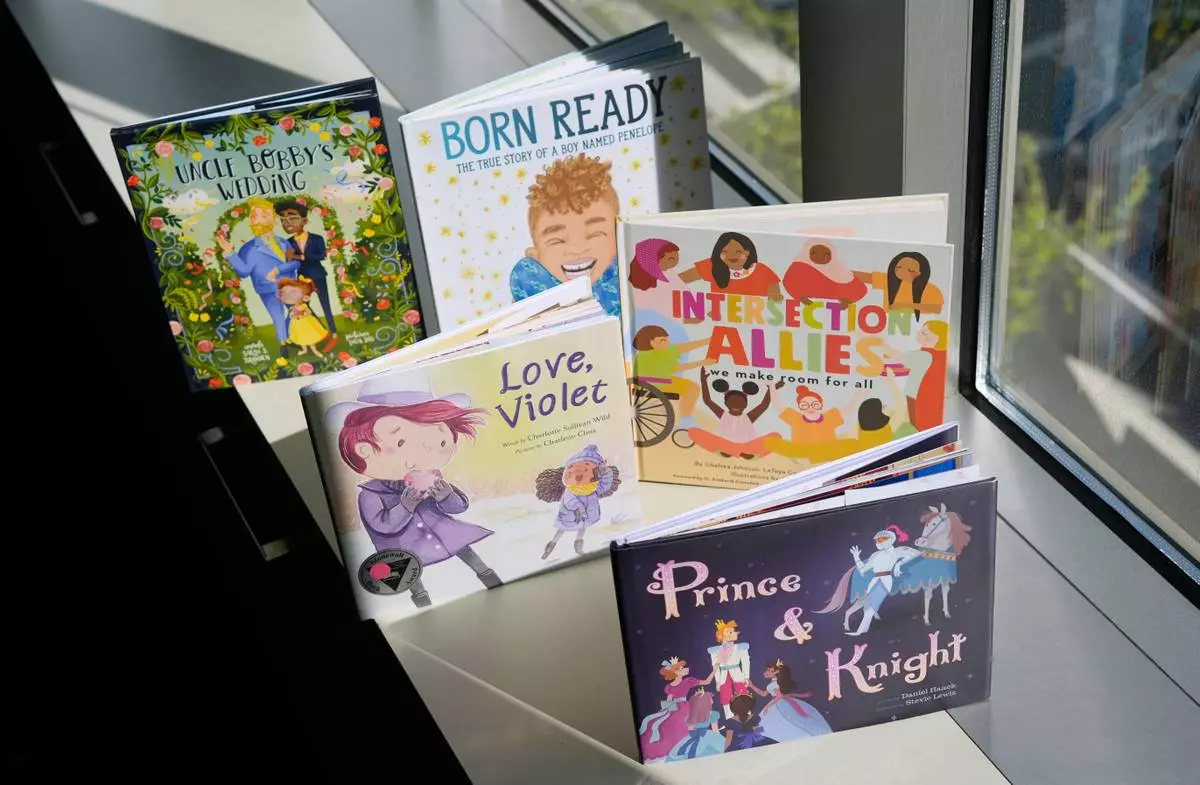 A selection of books featuring LGBTQ characters that are part of a Supreme Court case are pictured, Tuesday, April, 15, 2025, in Washington. (AP Photo/Pablo Martinez Monsivais)
