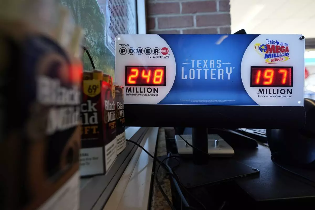 FILE - A Texas Lottery sales terminal shows the jackpot amounts up to win at Fuel City in Dallas, Wednesday, Feb. 26, 2025. (AP Photo/LM Otero, File)
