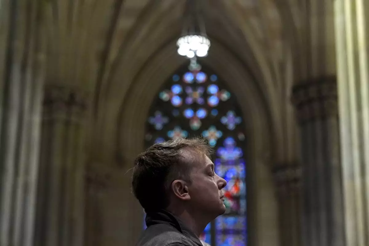 A parishioner prays during a memorial mass for the late Pope Francis at St. Patrick's Cathedral, Saturday, April 26, 2025, in New York. (AP Photo/Julia Demaree Nikhinson)