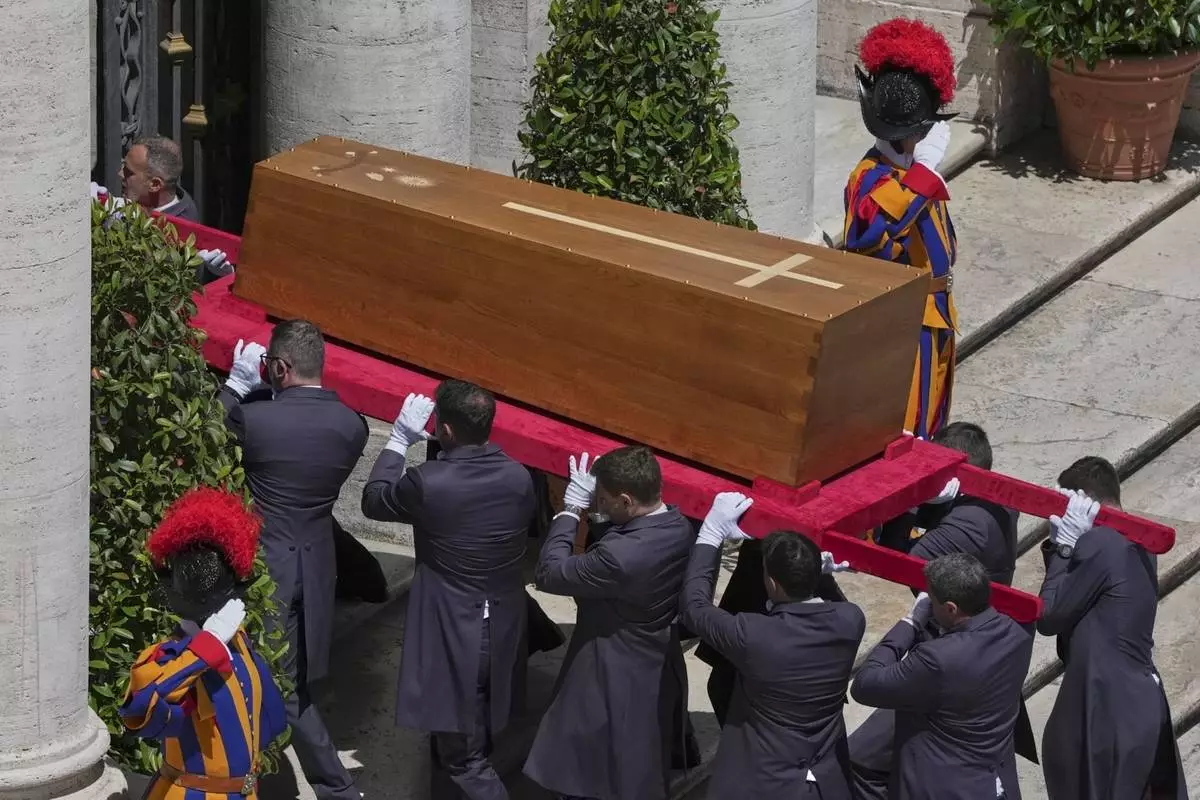 The coffin of Pope Francis is carried inside St. Mary Major Basilica for his burial ceremony, in Rome, Saturday, April 26, 2025. (AP Photo/Antonietta Baldassarre)