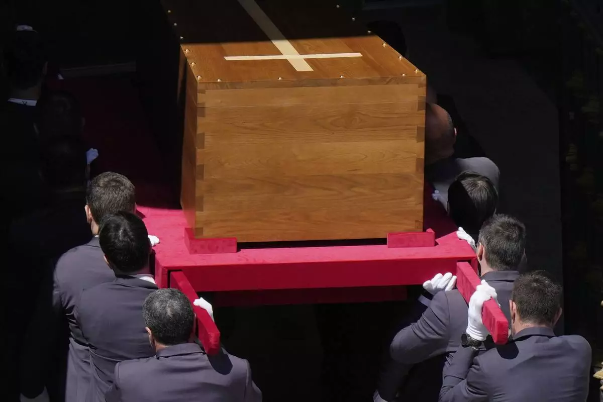 The coffin of Pope Francis is carried into St. Mary Major Basilica in Rome, Saturday, April 26, 2025. (AP Photo/Luca Bruno)