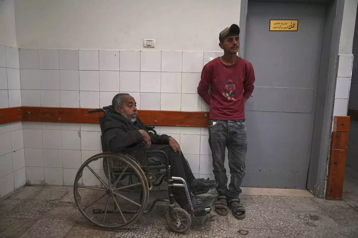 Mohamed Attiya, 54, waits for a dialysis session next to his son, Wasem, at Shifa hospital in Gaza City, Monday, April 14, 2025.(AP Photo/(AP Photo/Jehad Alshrafi)
