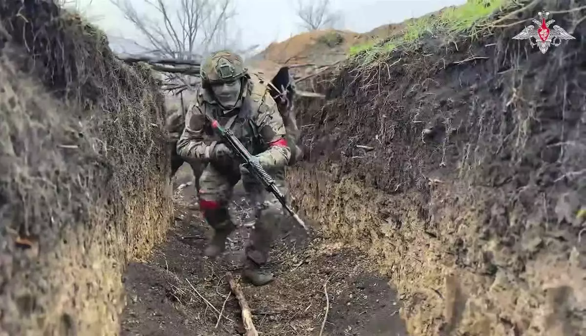 In this photo taken from video distributed by Russian Defense Ministry Press Service on Monday, April 14, 2025, Russian servicemen attend a combat training for assault units in an undisclosed location. (Russian Defense Ministry Press Service via AP)