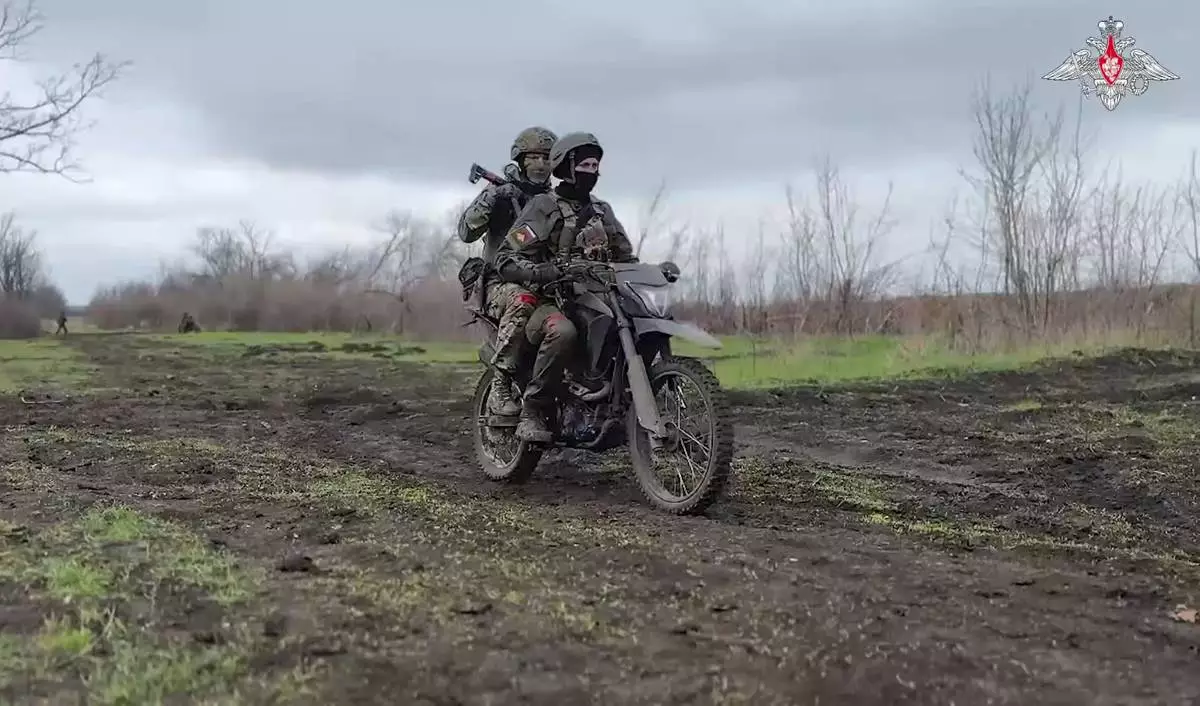 In this photo taken from video distributed by Russian Defense Ministry Press Service on Monday, April 14, 2025, Russian servicemen attend a combat training for assault units in an undisclosed location. (Russian Defense Ministry Press Service via AP)