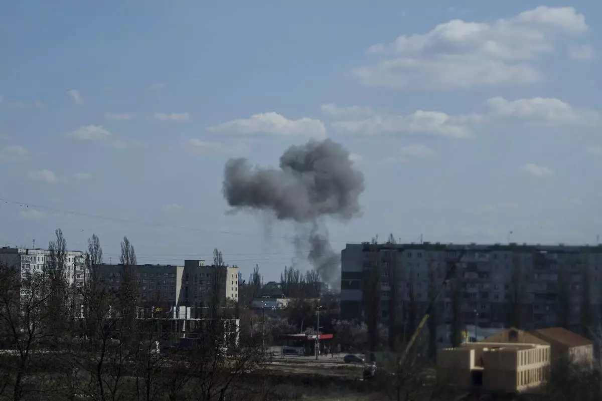 Smoke rises from an explosion following a Russian drone strike on Sumy, Ukraine, Monday, April 14, 2025. (AP Photo/Evgeniy Maloletka)