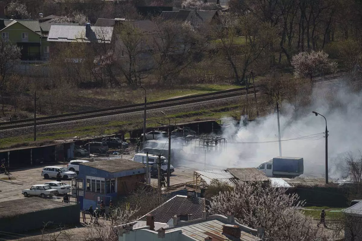 Smoke rises from an explosion following a Russian drone strike on Sumy, Ukraine, Monday, April 14, 2025. (AP Photo/Evgeniy Maloletka)