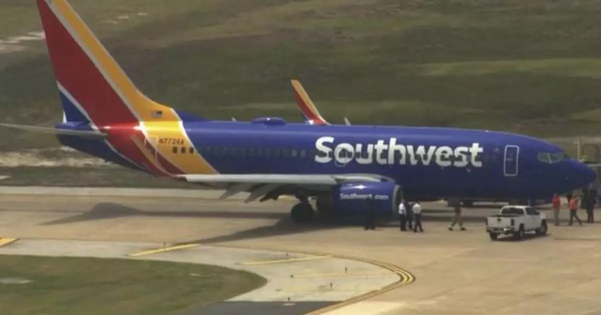 Passengers on Southwest flight evacuated after engine fire forces plane's return