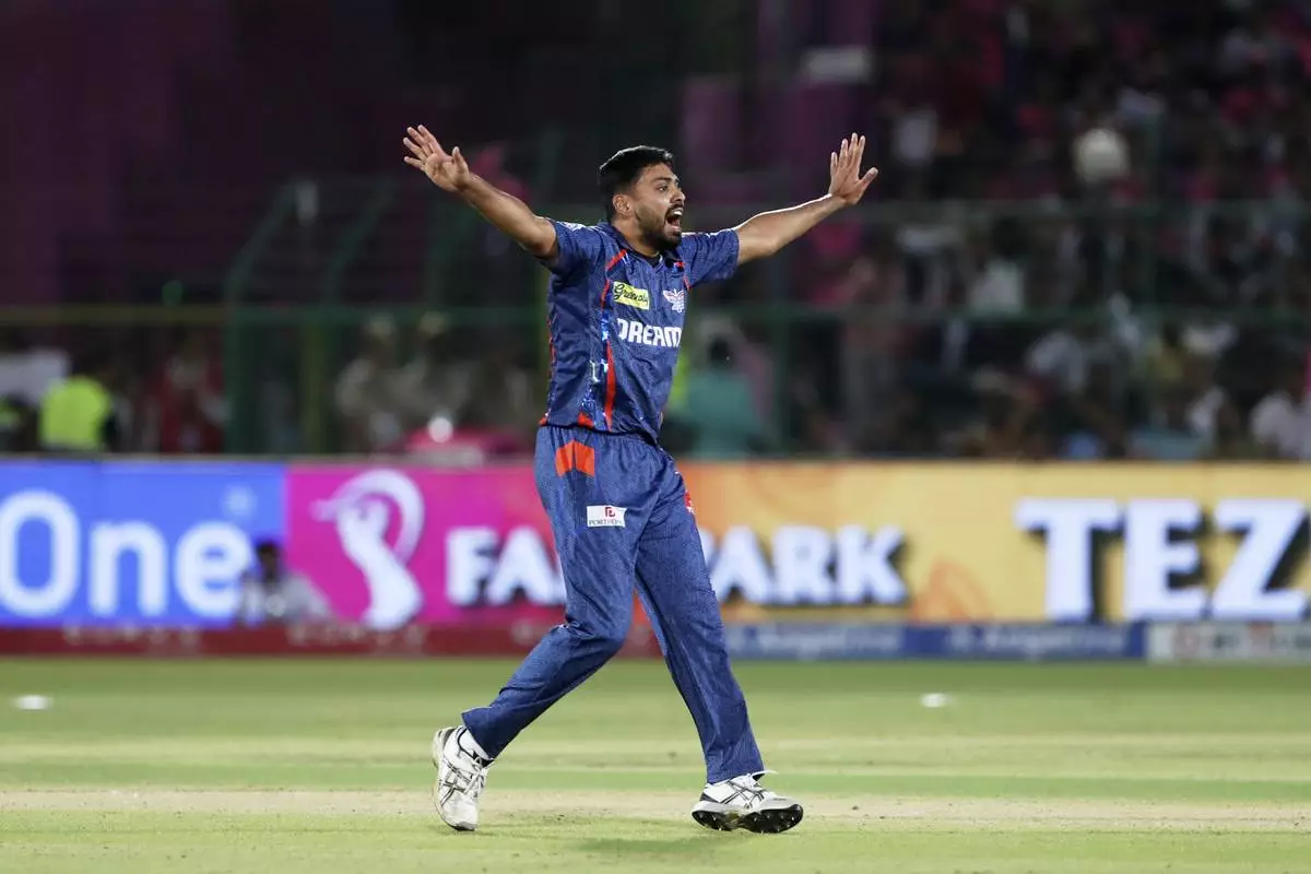 Lucknow Super Giants' Avesh Khan appeals successfully for the wicket of Rajasthan Royals' captain Riyan Parag during the Indian Premier League cricket match between Lucknow Super Giants and Rajasthan Royals at Sawai Mansingh Stadium in Jaipur, India, Saturday, April 19, 2025. (AP Photo/Surjeet Yadav)