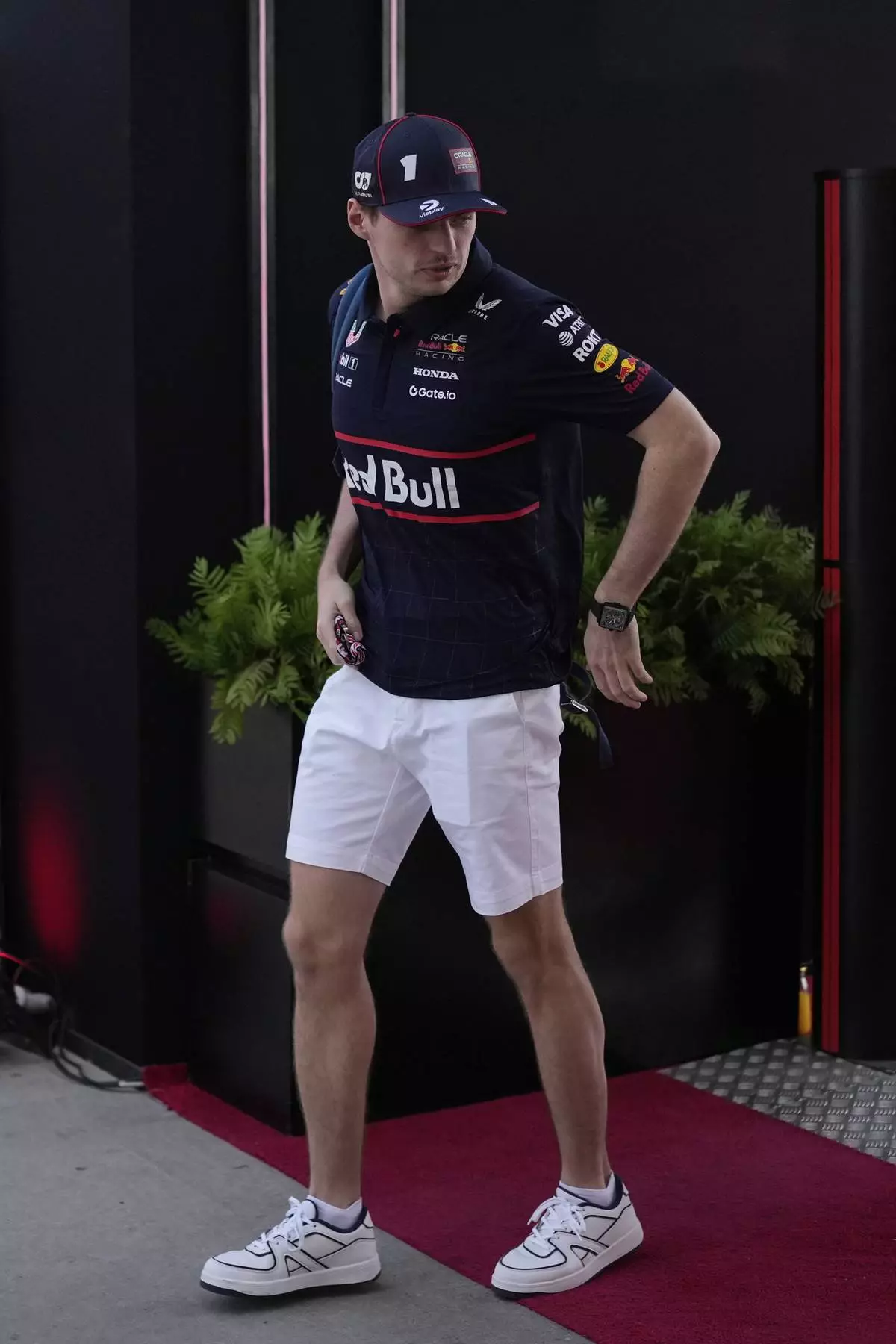 Red Bull driver Max Verstappen of the Netherlands arrives to the track for the Formula One Bahrain Grand Prix at the Bahrain International Circuit in Sakhir, Bahrain, Sunday, April 13, 2025. (AP Photo/Altaf Qadri)