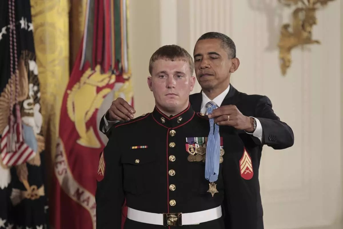 FILE - President Barack Obama awards the Medal of Honor to Marine Corps Cpl. Dakota Meyer, 23, from Greensburg, Ky, in a ceremony in the East Room of the White House in Washington, Sept., 15, 2011. (AP Photo/Pablo Martinez Monsivais, File)