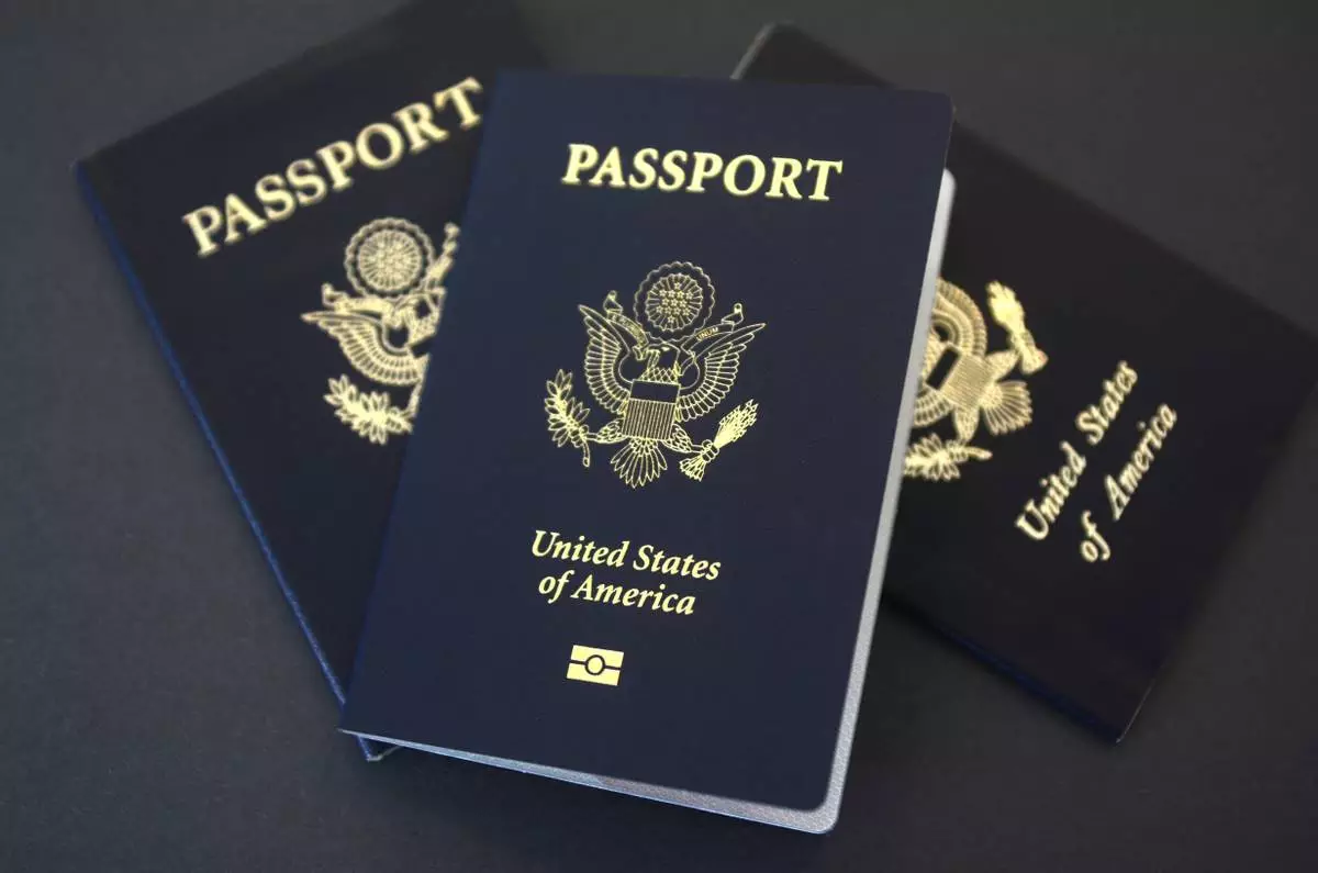 In this May 9, 2017, file photo, U.S. passports lie on a table in Dallas. (AP Photo/Benny Snyder, File)