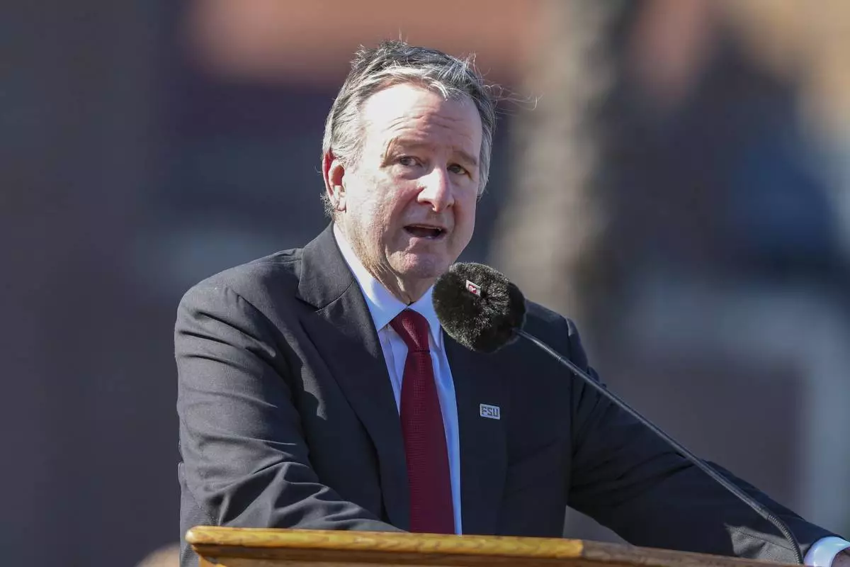 The day after an active shooter on campus Florida State president Richard McCullough addresses a vigil on campus at Langford Green, Tallahassee, Fla., Friday, April 18, 2025. (AP Photo/Gary McCullough)