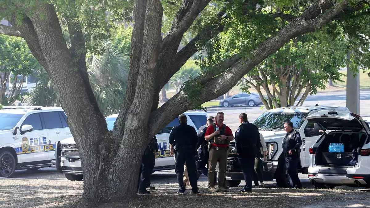 Law enforcement officers gather after a shooting at Florida State University in Tallahassee, Fla., Thursday, April 17, 2025. (AP Photo/Gary McCullough)