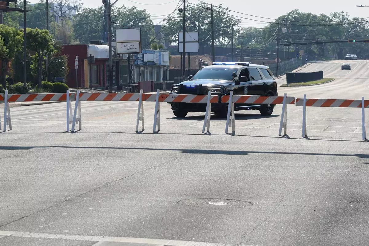The Florida State University Student Union building and surrounding roads are blocked by law enforcement vehicles, Tallahassee, Fla., Thursday, April 17, 2025. (AP Photo/Gary McCullough)