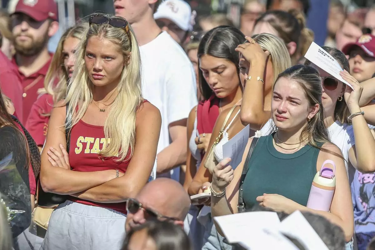 The day after an active shooter on campus Florida State held a vigil on campus at Langford Green, Tallahassee, Fla., Friday, April 18, 2025. (AP Photo/Gary McCullough)