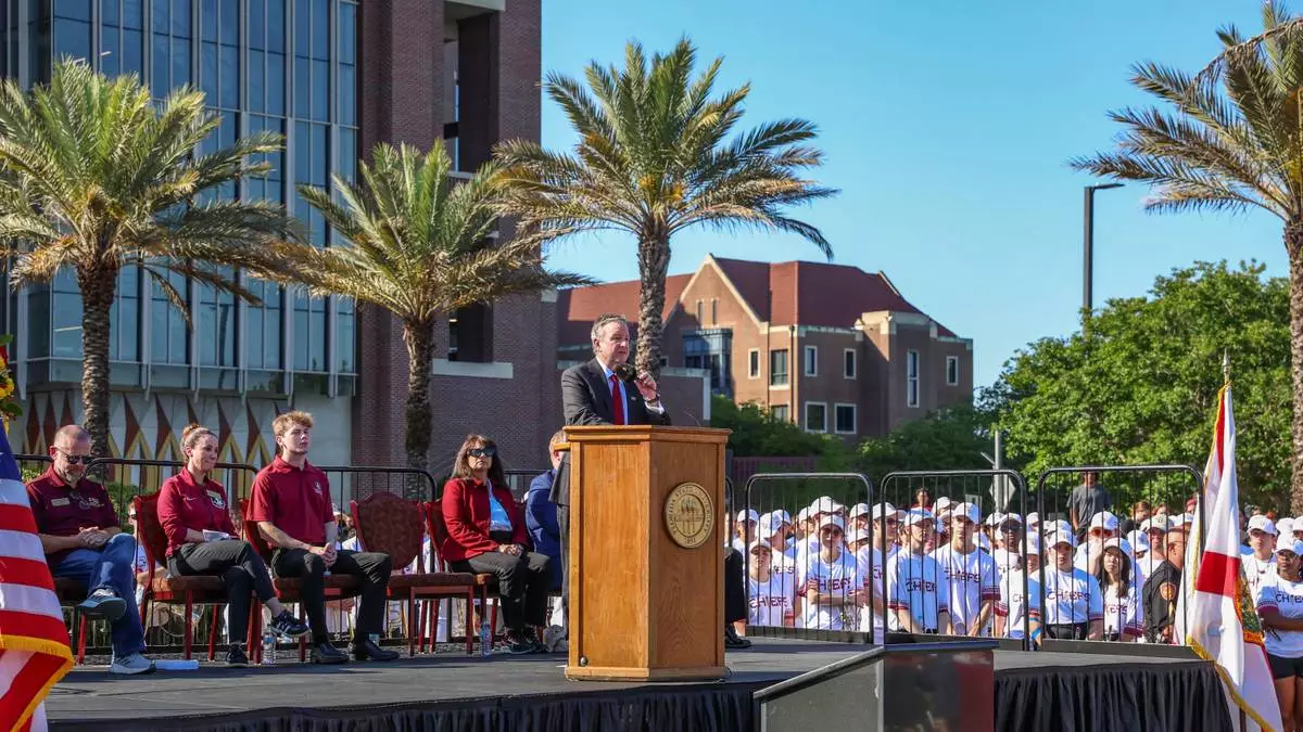 The day after an active shooter on campus Florida State president Richard McCullough addresses a vigil on campus at Langford Green, Tallahassee, Fla., Friday, April 18, 2025. (AP Photo/Gary McCullough)