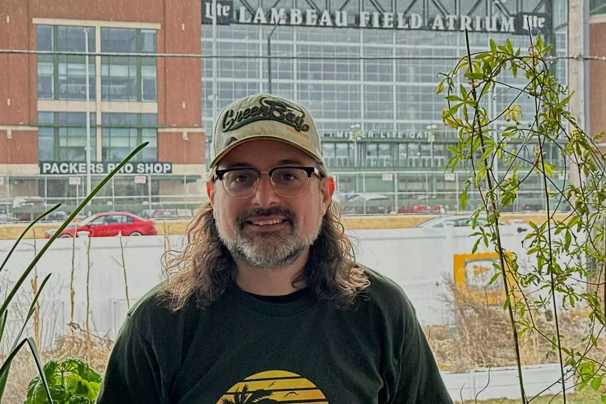 Corey Behnke, is photographed across the street from Lambeau Field on Thursday, April 17, 2025 in Green Bay, Wis. (AP Photo/Steve Megargee)