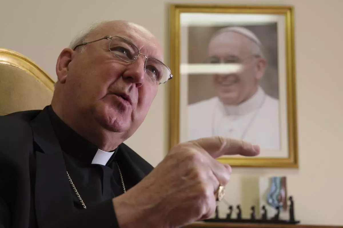 FILE - Cardinal Kevin Farrell talks during an interview with The Associated Press in his office in Rome on July 31, 2018. (AP Photo/Paolo Santalucia, File)