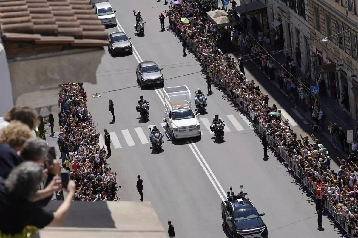 The coffin of Pope Francis makes its way to St. Mary Major Basilica in Rome, Saturday, April 26, 2025. (AP Photo/Luca Bruno)