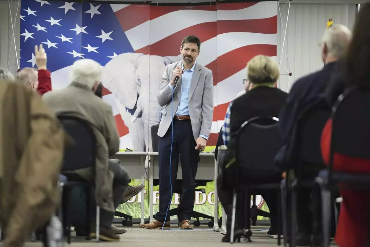 Ryan Kelley listens to a question during his talk at the Jackson County Republican headquarters, Thursday, April 10, 2025, in Jackson, Mich. (AP Photo/Paul Sancya)