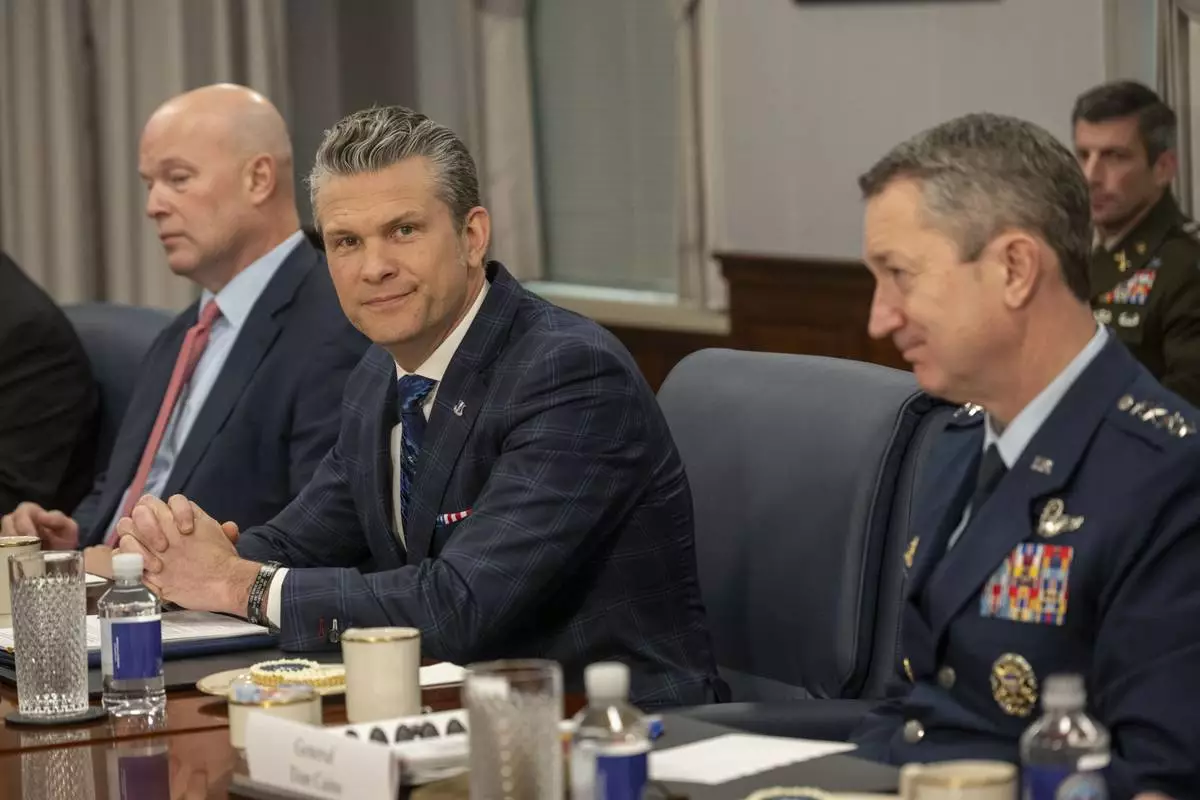 Defense Secretary Pete Hegseth, right, meets with NATO Secretary General Mark Rutte at the Pentagon, Thursday, April 24, 2025 in Washington. (AP Photo/Kevin Wolf)
